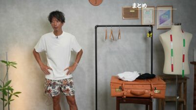 NG3アイテム（タンクトップ・サングラス・Tシャツ）をまとめながら話すたくぞーのカット